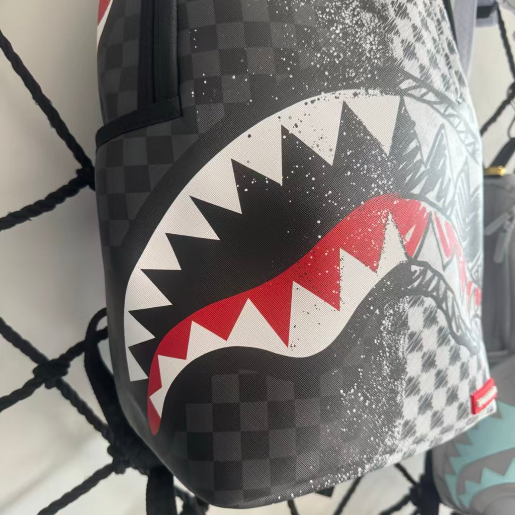 Urban Streetwear Backpack – Black & White Scribble Checkerboard with Shark Mouth and Splatter Design