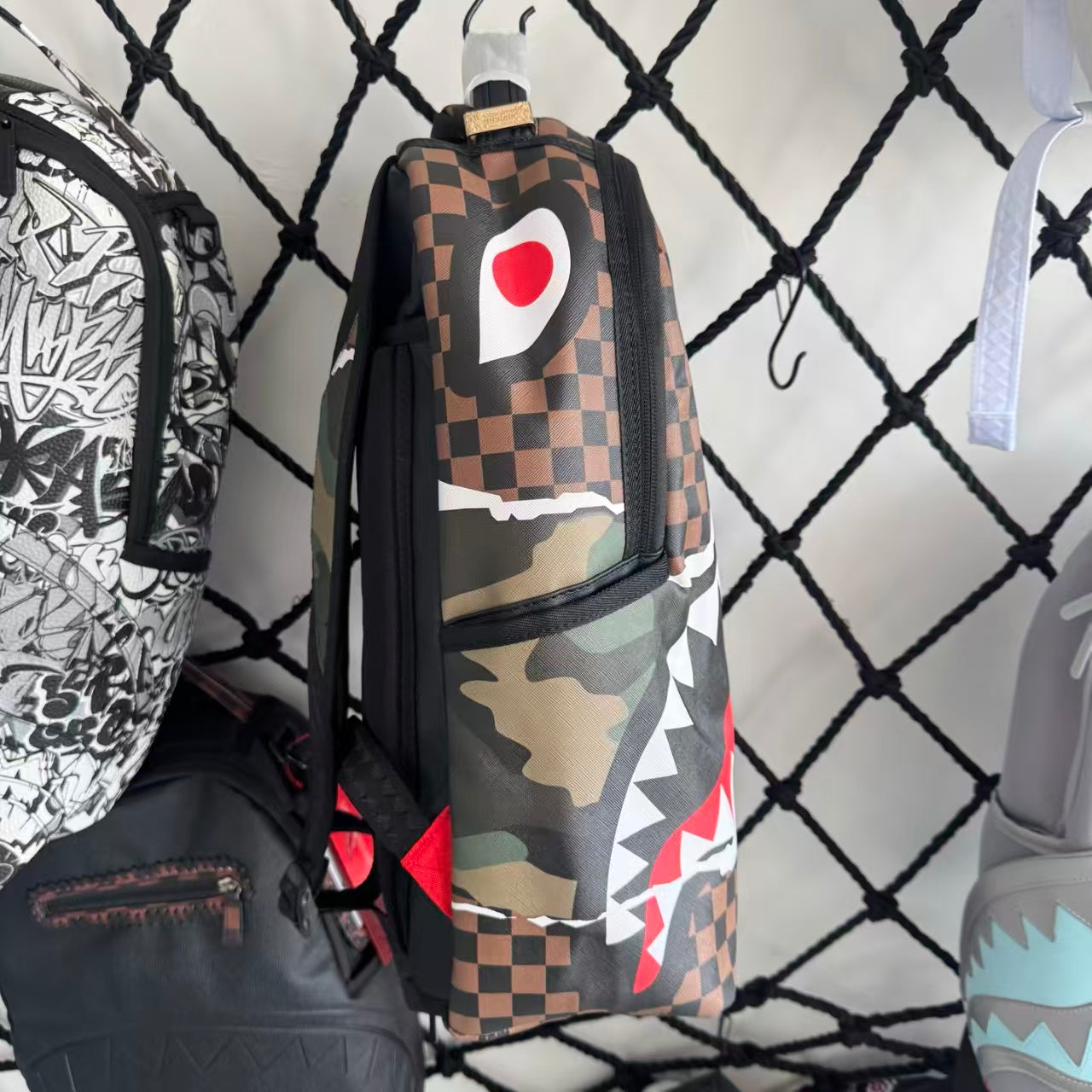 Urban Streetwear Backpack – Brown & Black Checkerboard Camo Torn-Paper Shark Mouth Design