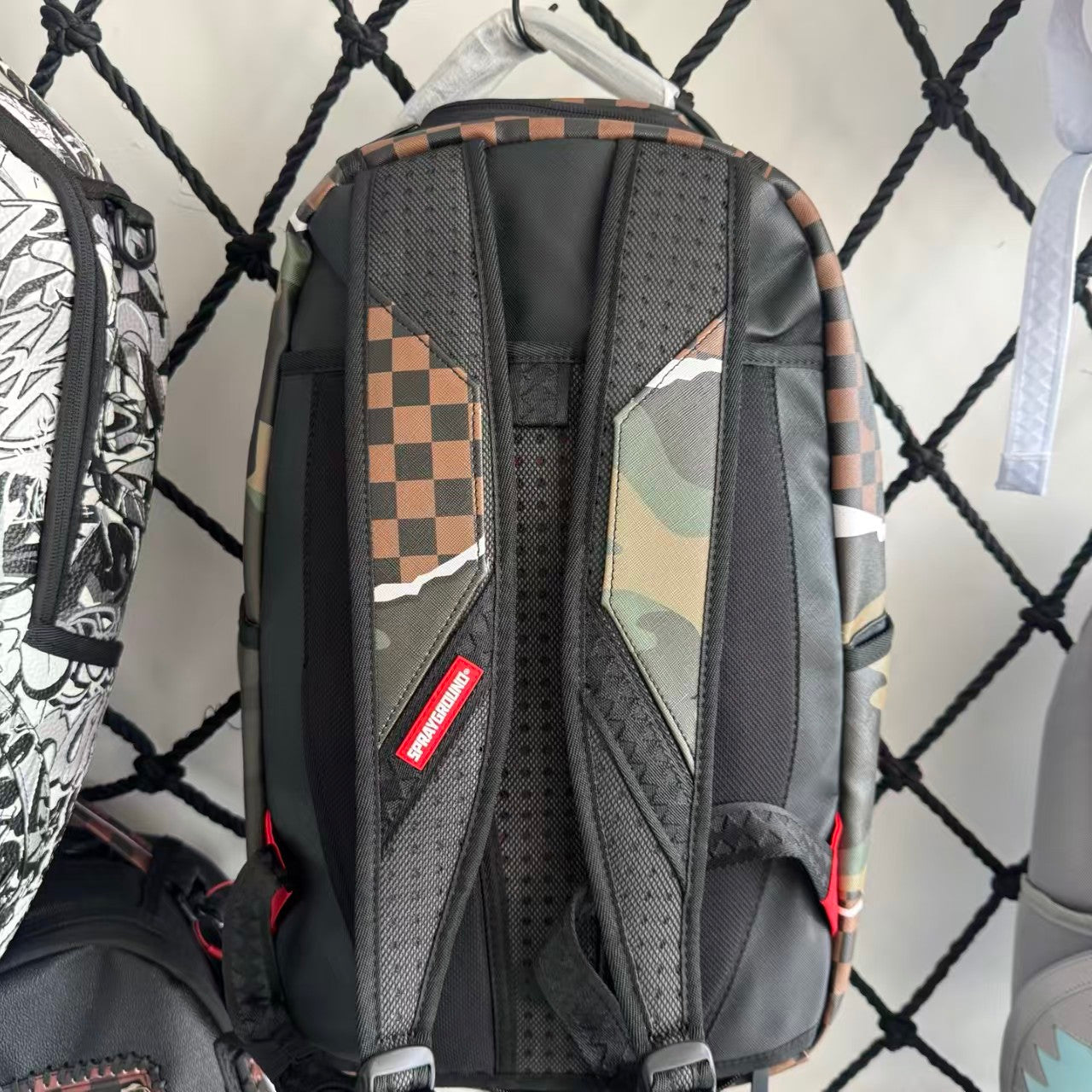 Urban Streetwear Backpack – Brown & Black Checkerboard Camo Torn-Paper Shark Mouth Design