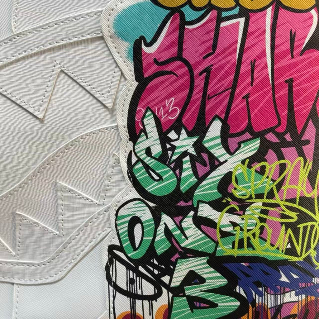 White Backpack with 3D Stitched Shark Mouth and Colorful Graffiti Splice Design