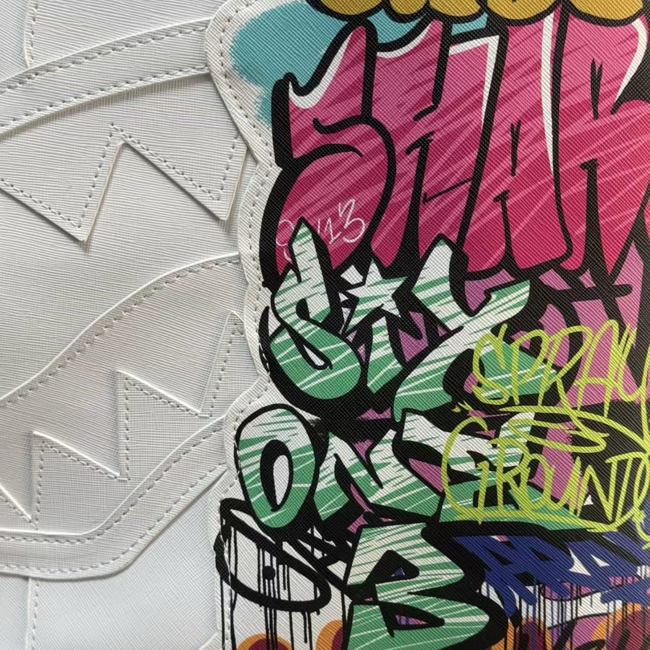 White Backpack with 3D Stitched Shark Mouth and Colorful Graffiti Splice Design