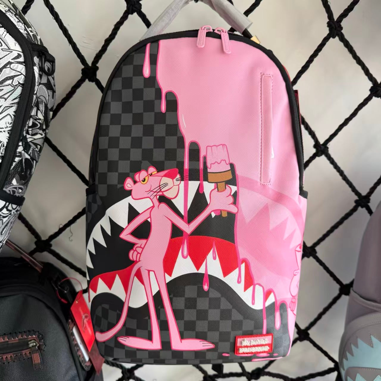 Pink Panther Themed Streetwear Backpack – Melting Pink Ice Cream with Checkerboard and Shark Mouth Design