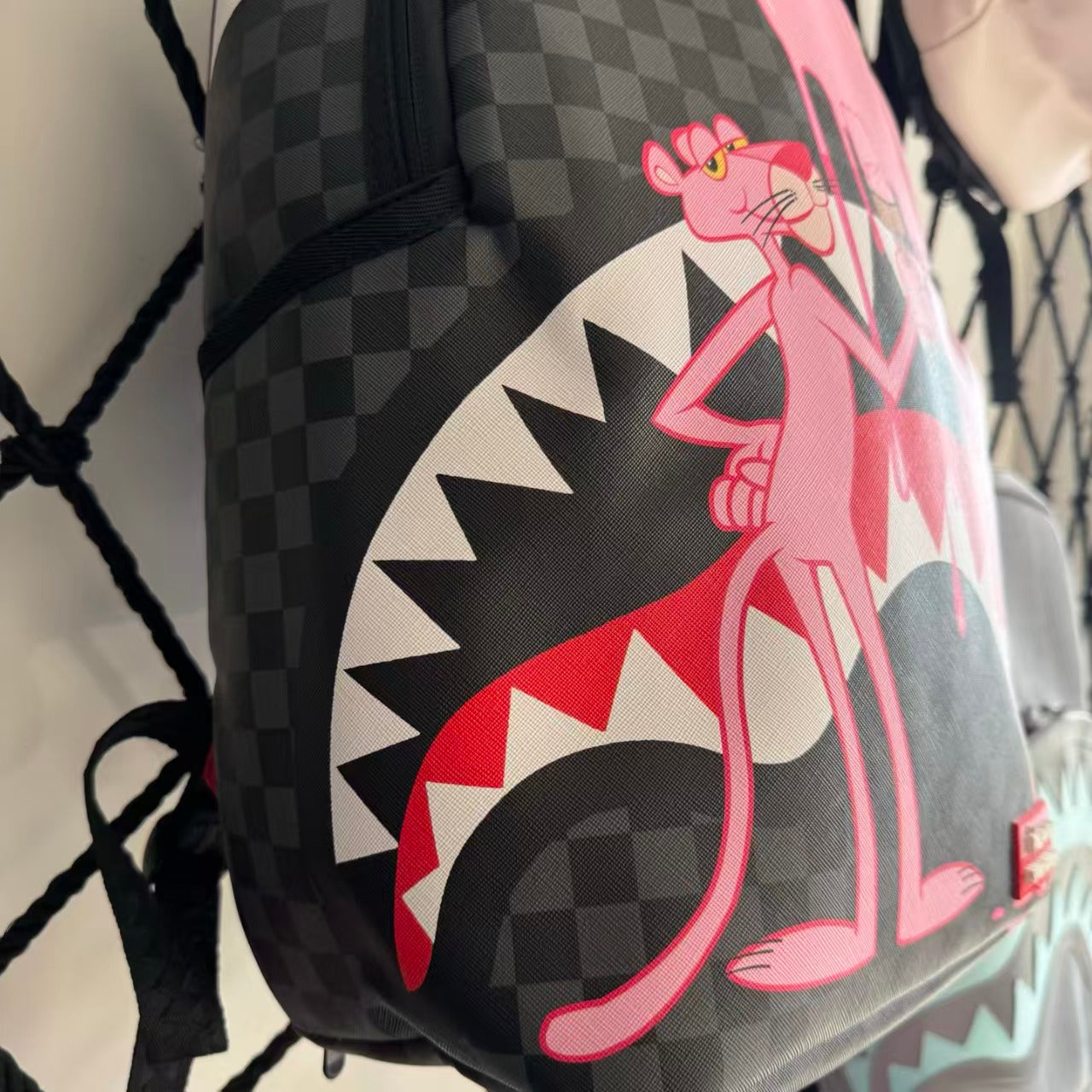 Pink Panther Themed Streetwear Backpack – Melting Pink Ice Cream with Checkerboard and Shark Mouth Design