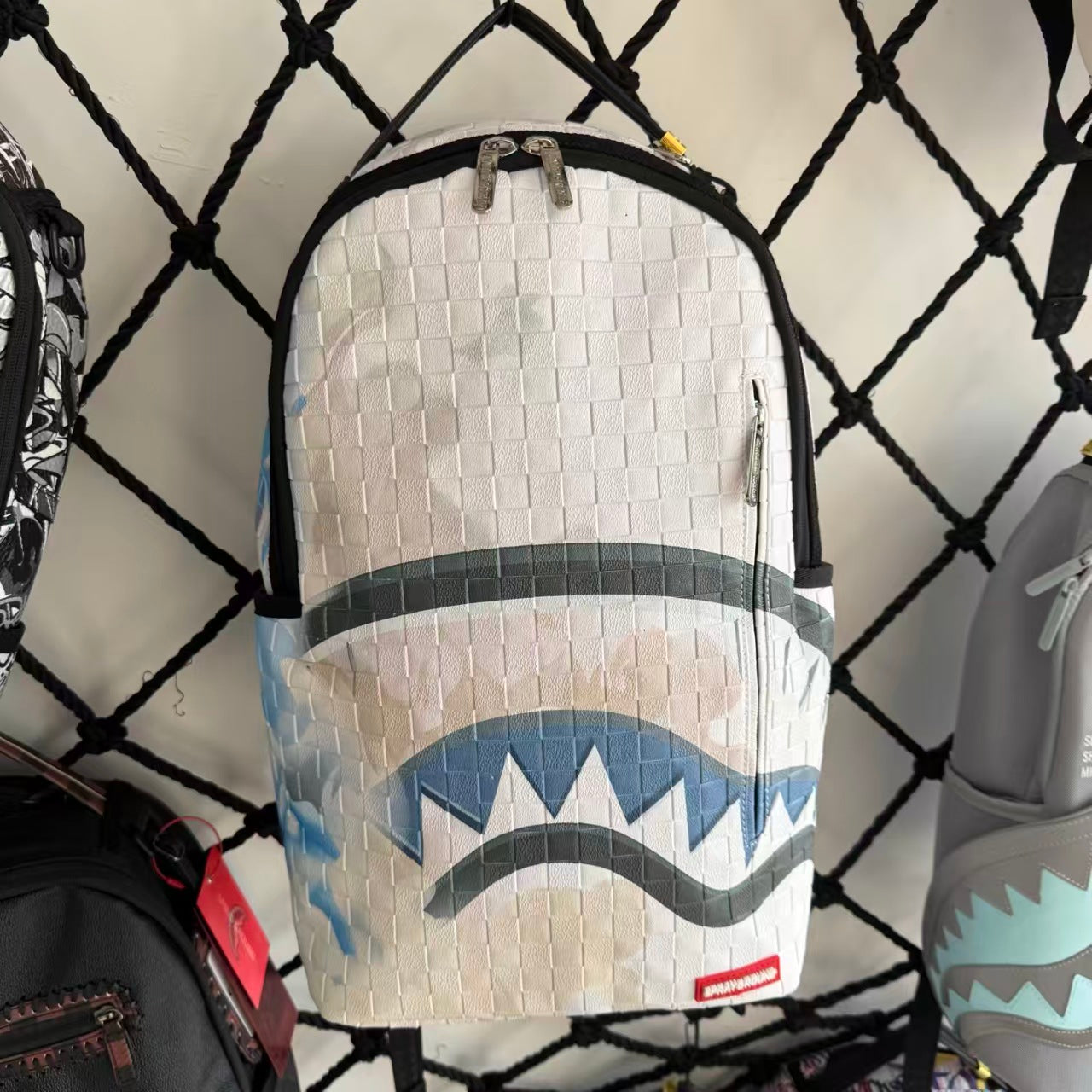 White 3D Woven Texture Streetwear Backpack - Grey-Blue Splatter Effect with Classic Shark Mouth Design