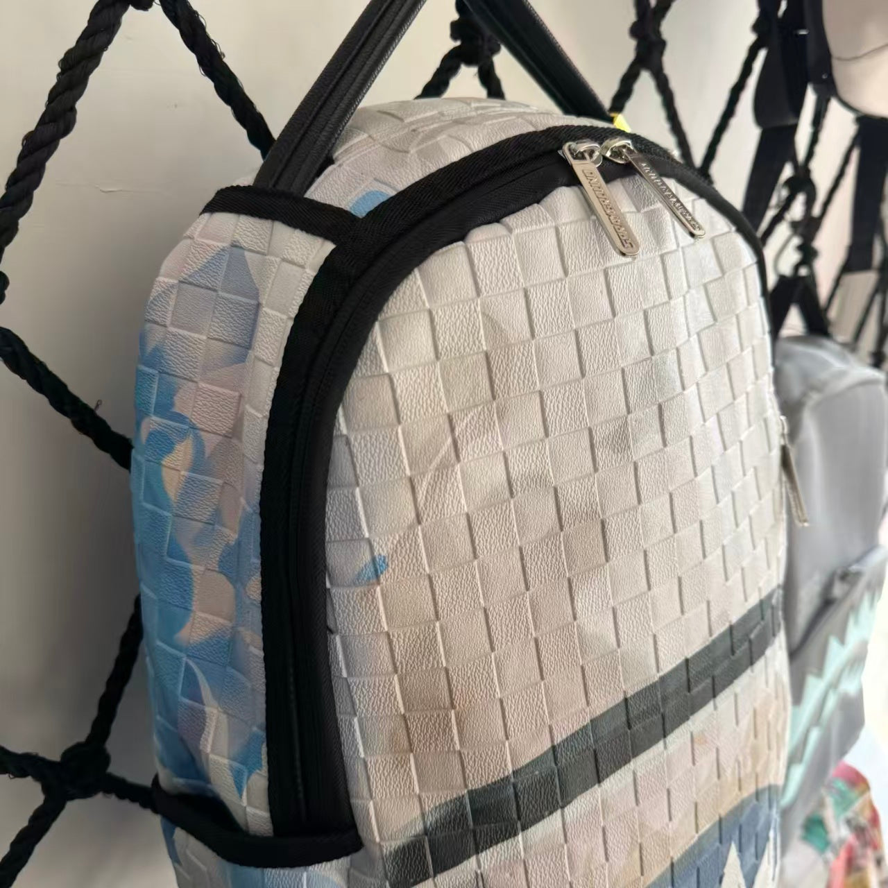 White 3D Woven Texture Streetwear Backpack - Grey-Blue Splatter Effect with Classic Shark Mouth Design