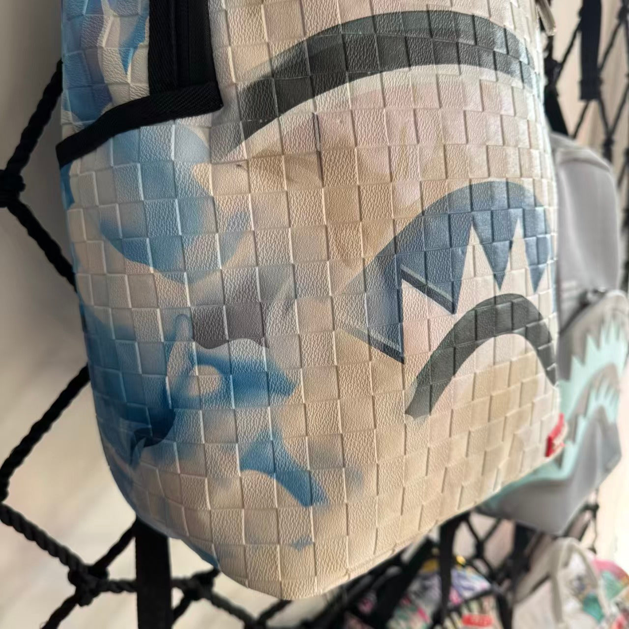 White 3D Woven Texture Streetwear Backpack - Grey-Blue Splatter Effect with Classic Shark Mouth Design