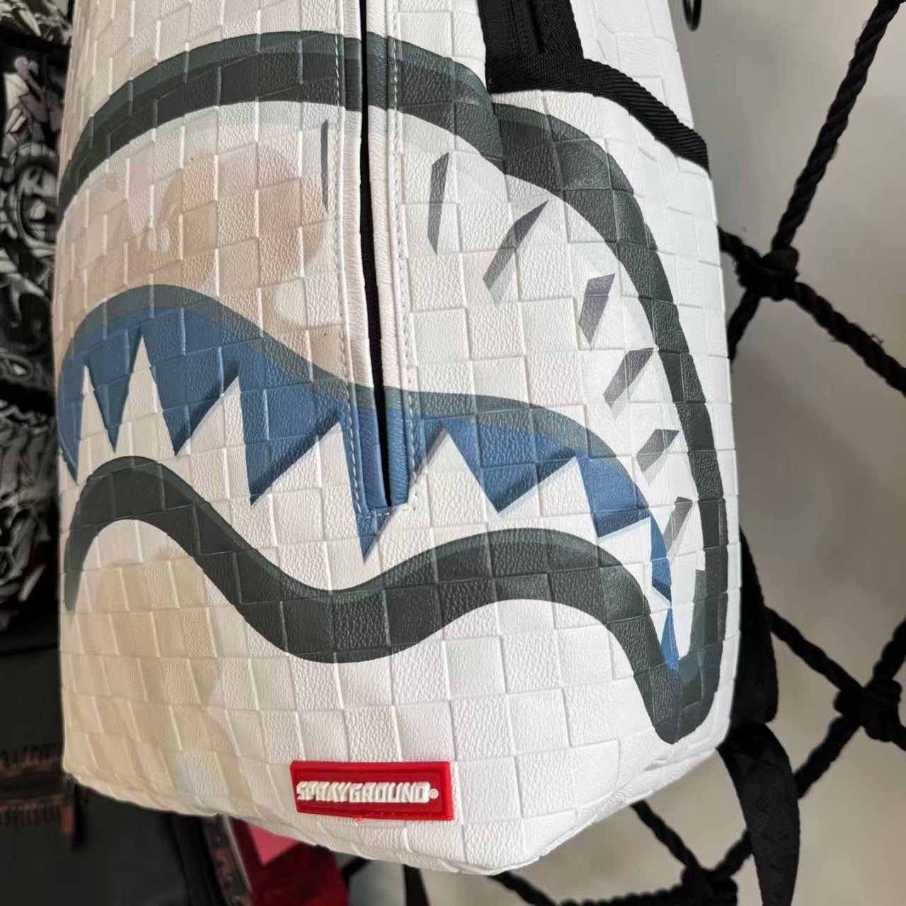 White 3D Woven Texture Streetwear Backpack - Grey-Blue Splatter Effect with Classic Shark Mouth Design