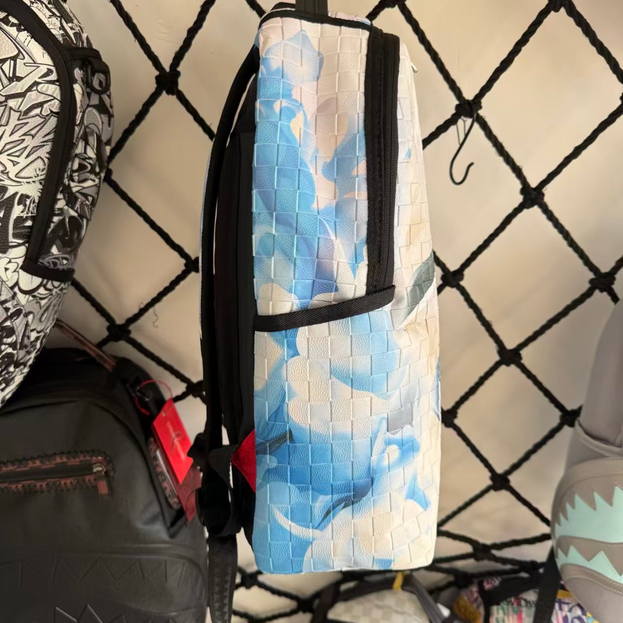 White 3D Woven Texture Streetwear Backpack - Grey-Blue Splatter Effect with Classic Shark Mouth Design