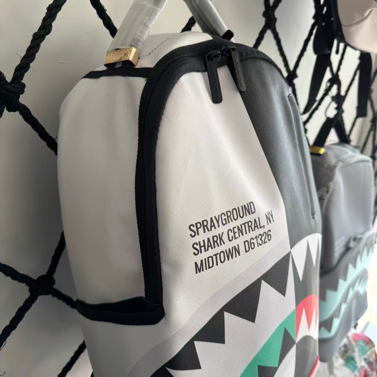 Black and White Split-Design Streetwear Backpack - Red and Green Contrast Shark Mouth with Text Print