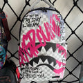 Pink Graffiti Splatter Streetwear Backpack - Grey Checkerboard with Handwritten Slogans and Shark Mouth Design