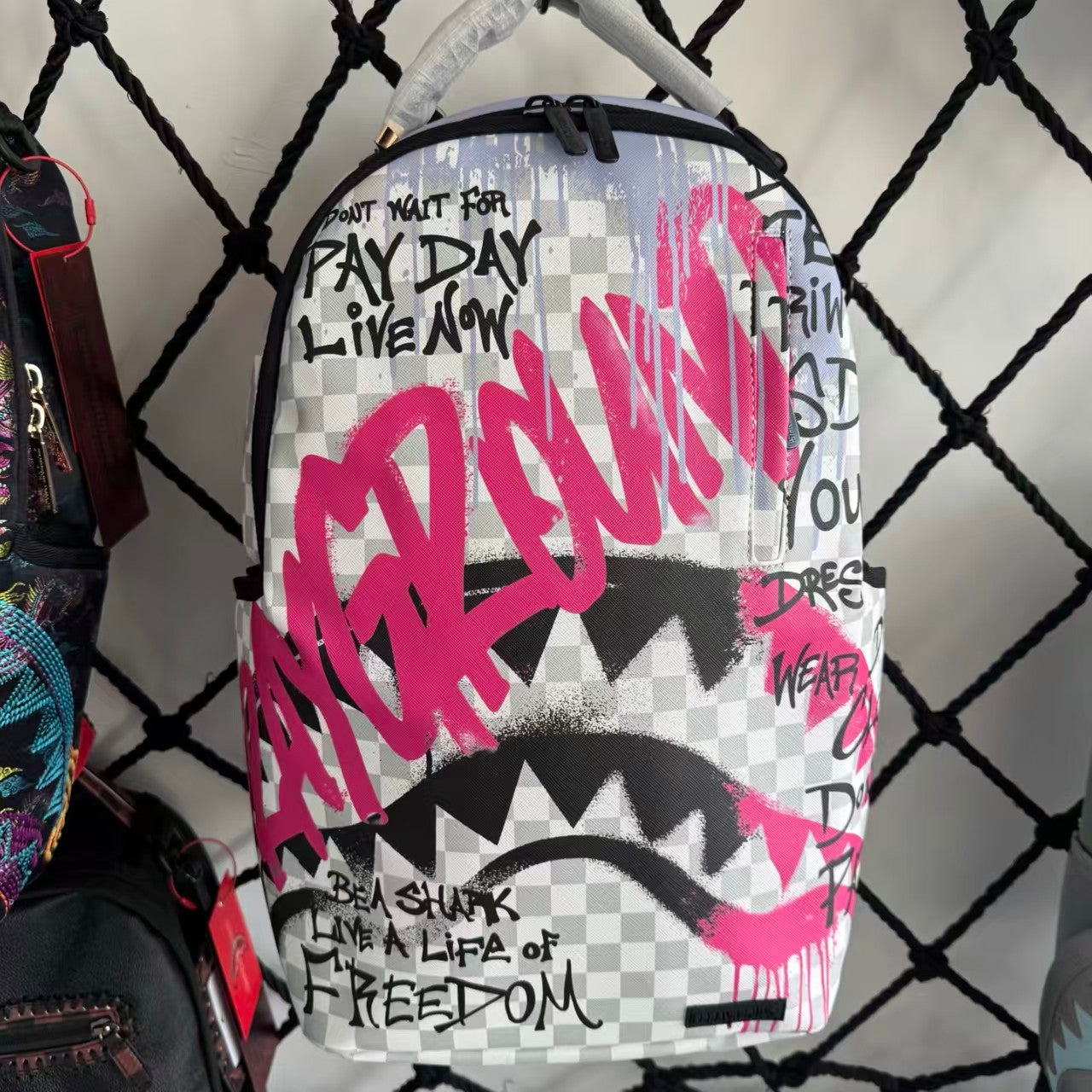 Pink Graffiti Splatter Streetwear Backpack - Grey Checkerboard with Handwritten Slogans and Shark Mouth Design