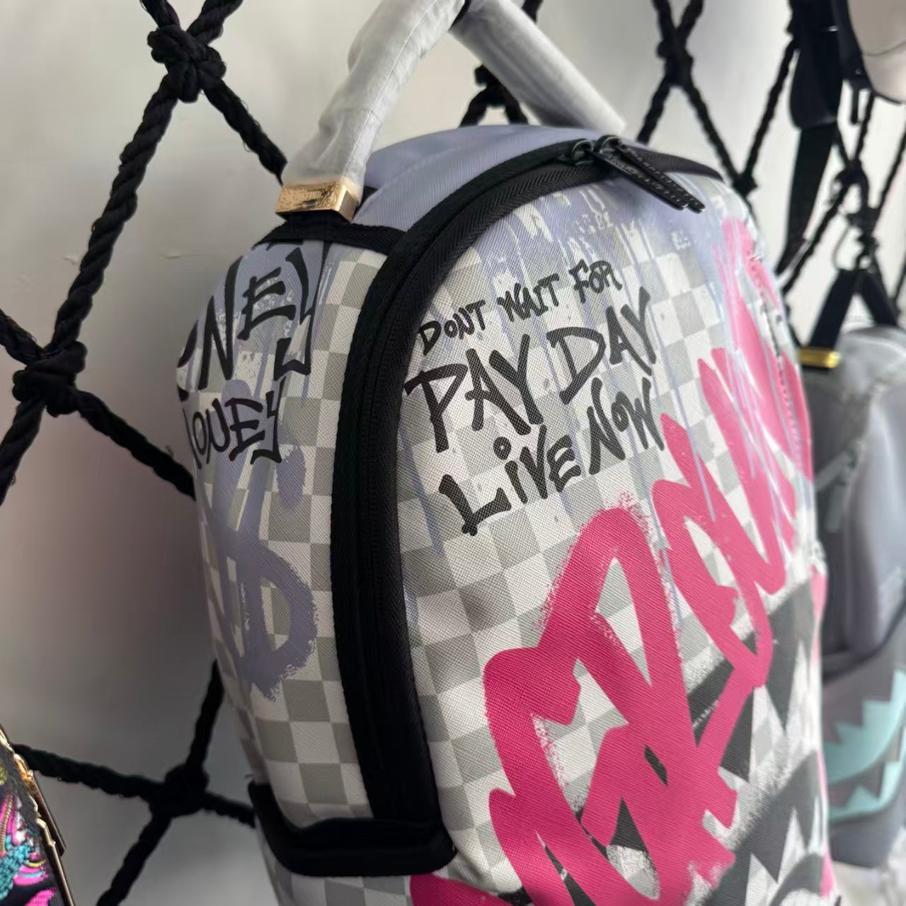 Pink Graffiti Splatter Streetwear Backpack - Grey Checkerboard with Handwritten Slogans and Shark Mouth Design