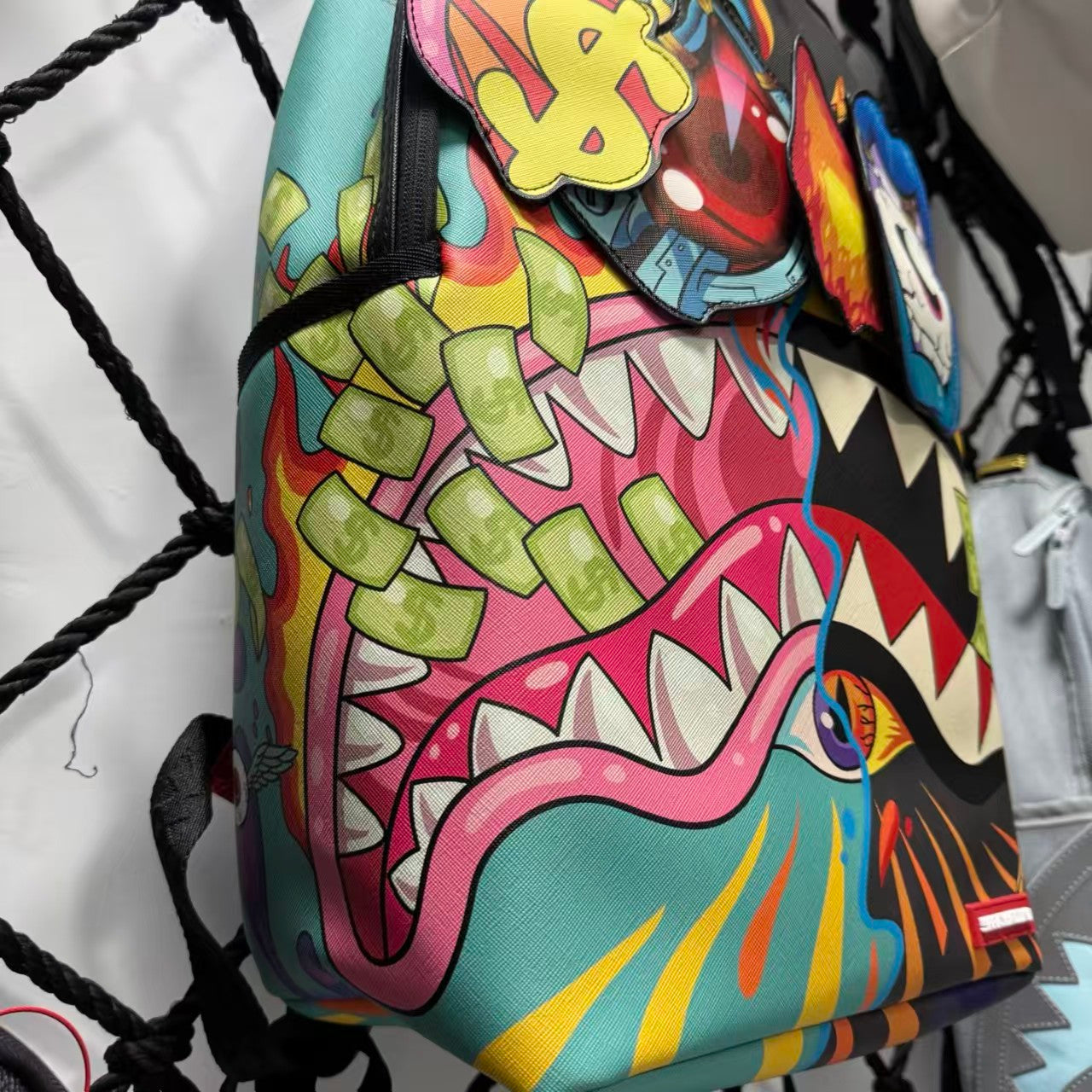 Colorful Graffiti Money Streetwear Backpack - Exaggerated Eye and Melting Dripping Pink Shark Mouth Design