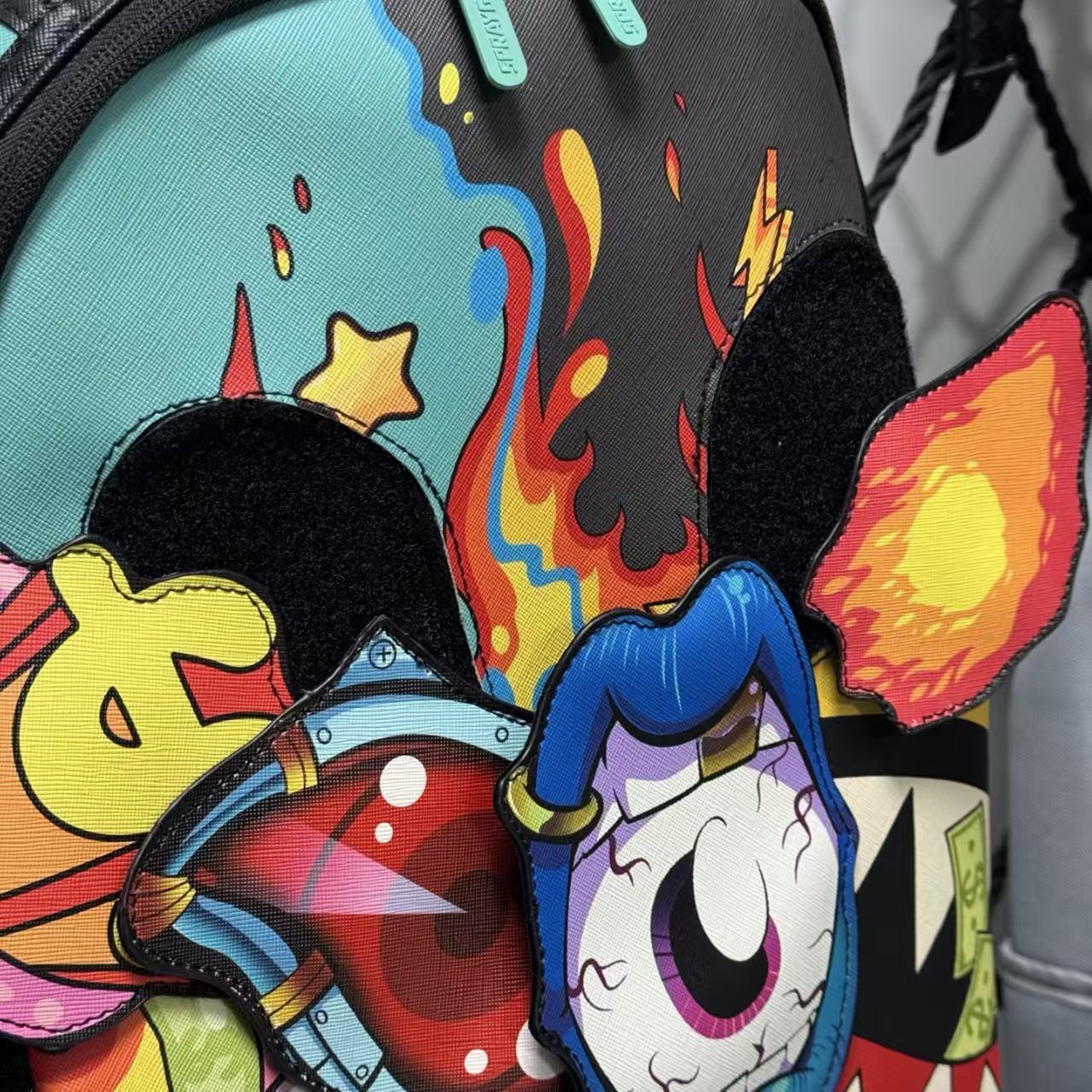 Colorful Graffiti Money Streetwear Backpack - Exaggerated Eye and Melting Dripping Pink Shark Mouth Design