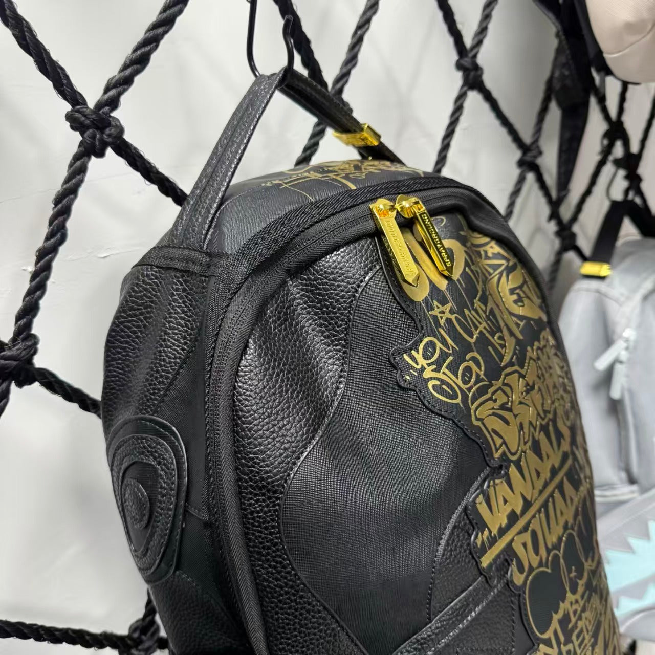 Black Textured Leather Streetwear Backpack - Gold Graffiti Lettering & 3D Shark Mouth Silhouette Design
