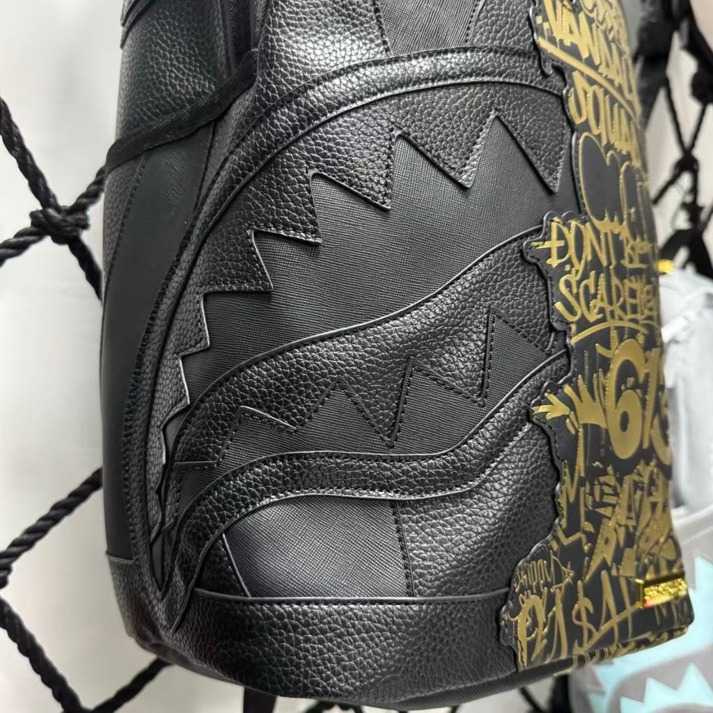 Black Textured Leather Streetwear Backpack - Gold Graffiti Lettering & 3D Shark Mouth Silhouette Design