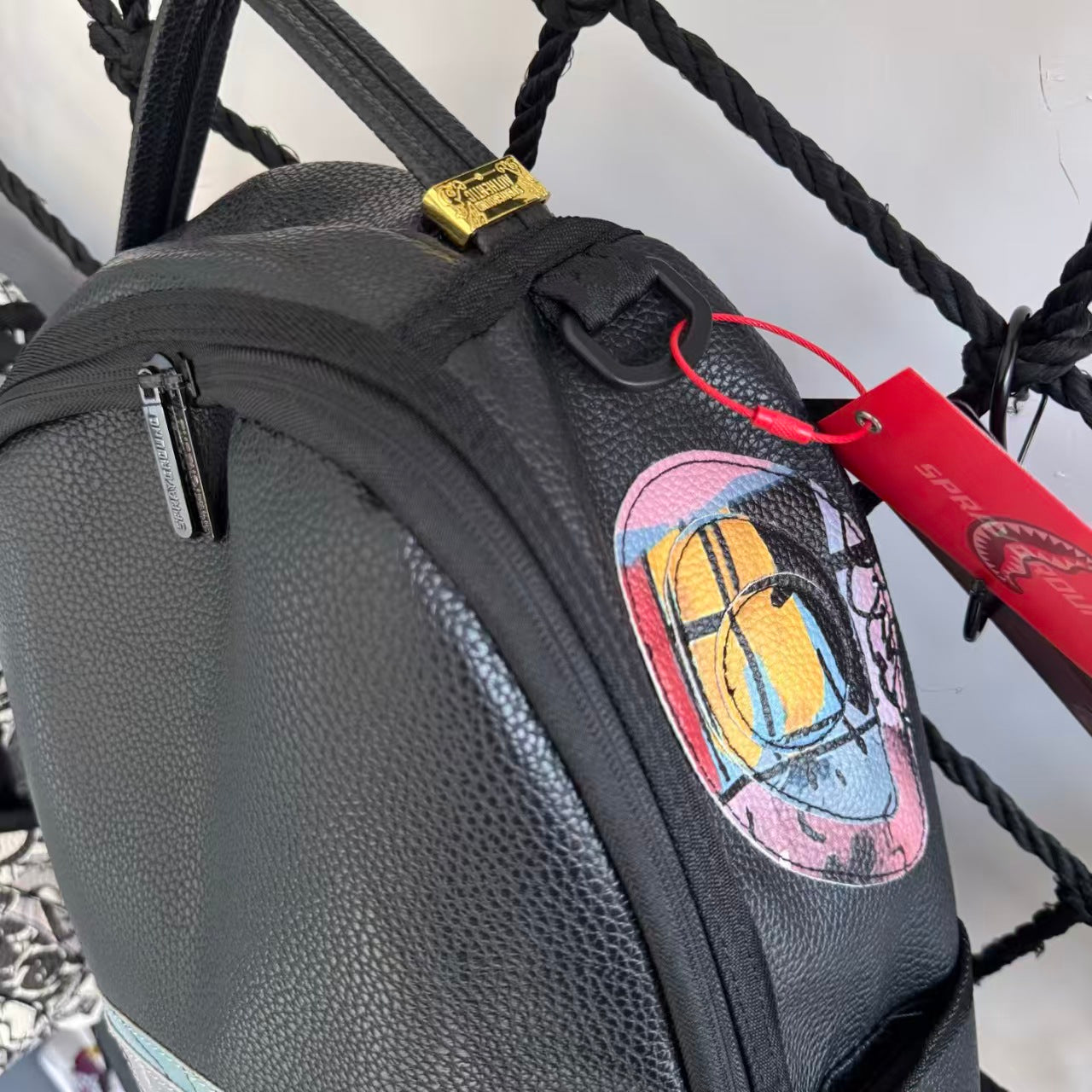 Black Pebbled Leather Backpack with Abstract Art Graffiti Splicing - Colorful Print Design