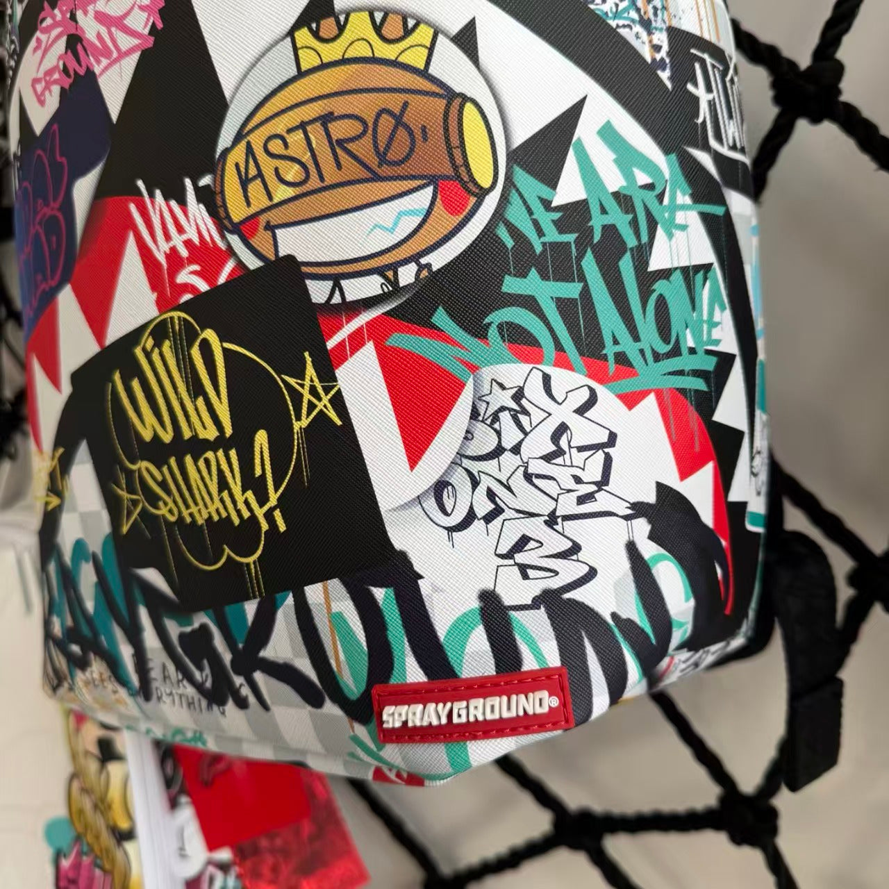 Streetwear Graffiti Collage Backpack - Light Checkerboard Base with Colorful Handwritten Lettering & Sticker Design