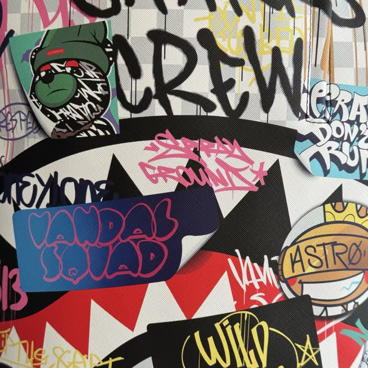 Streetwear Graffiti Collage Backpack - Light Checkerboard Base with Colorful Handwritten Lettering & Sticker Design