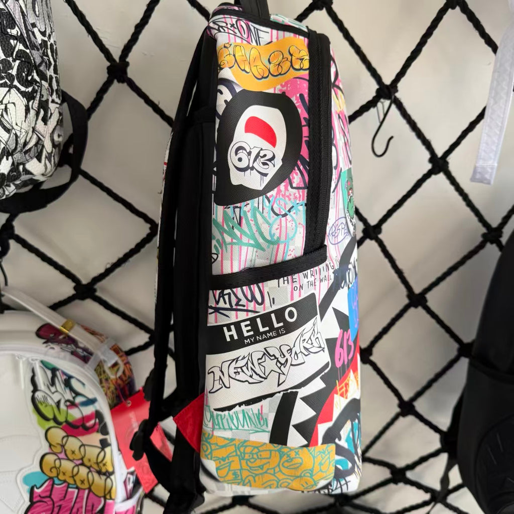Streetwear Graffiti Collage Backpack - Light Checkerboard Base with Colorful Handwritten Lettering & Sticker Design