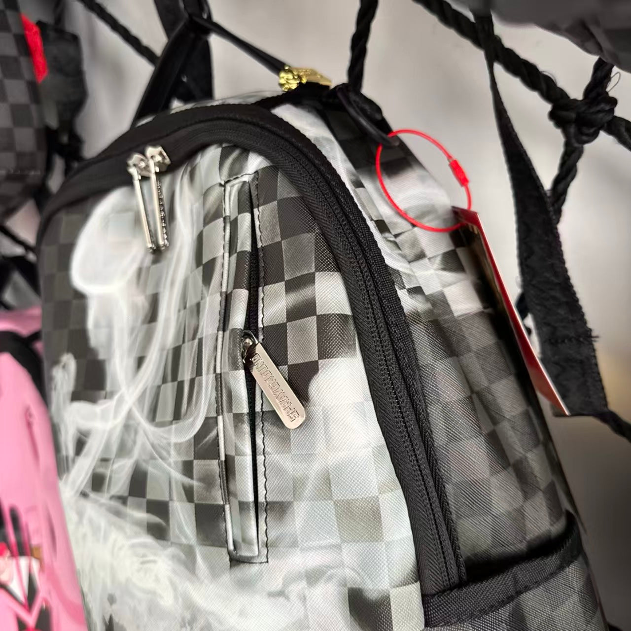 Black & Grey Checkerboard Backpack with Swirling White Smoke Effect