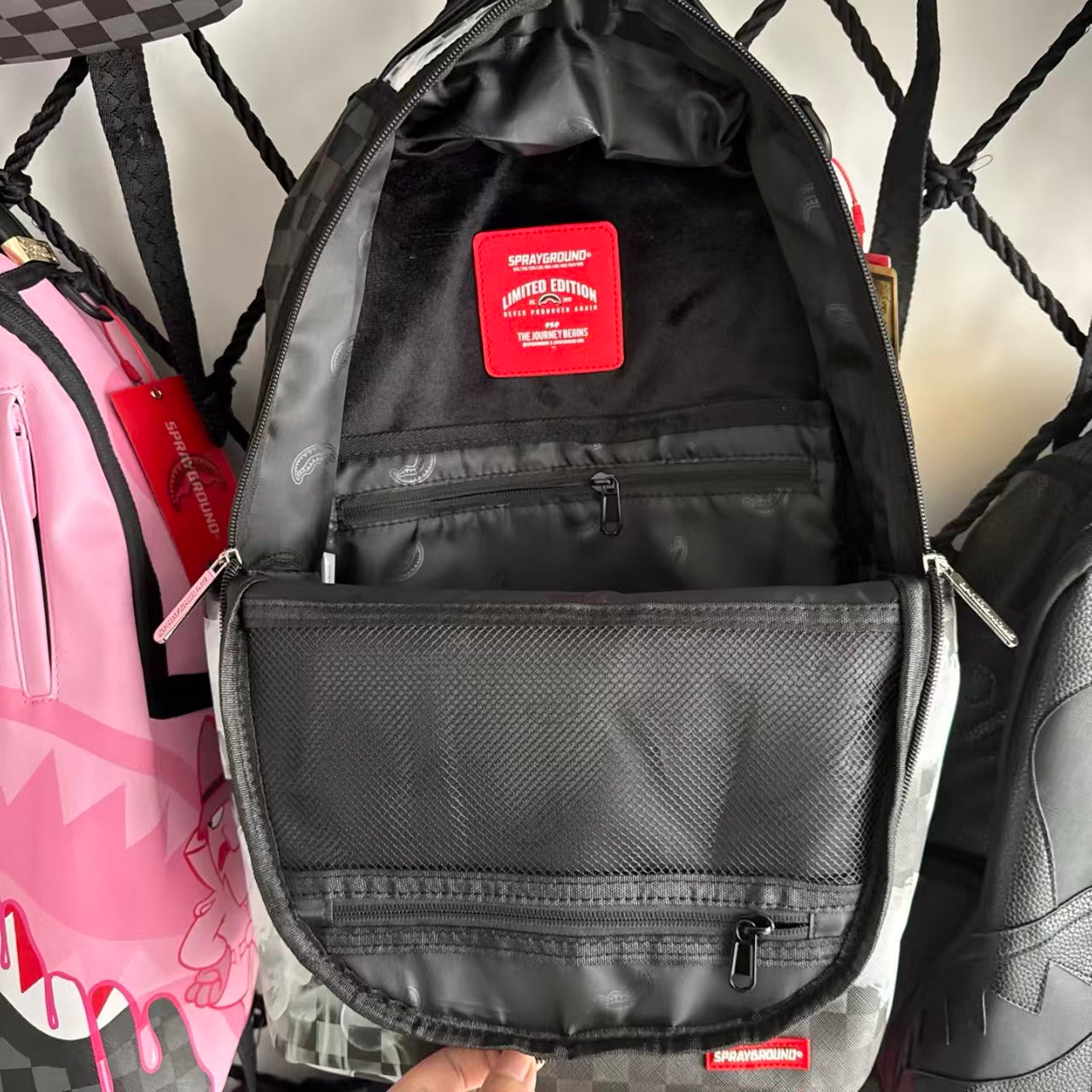 Black & Grey Checkerboard Backpack with Swirling White Smoke Effect