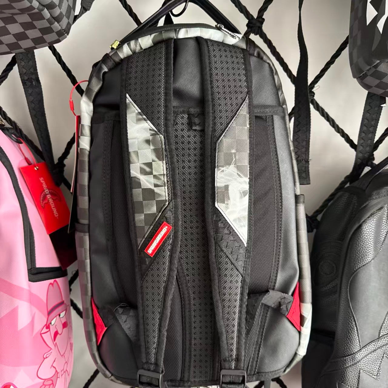 Black & Grey Checkerboard Backpack with Swirling White Smoke Effect