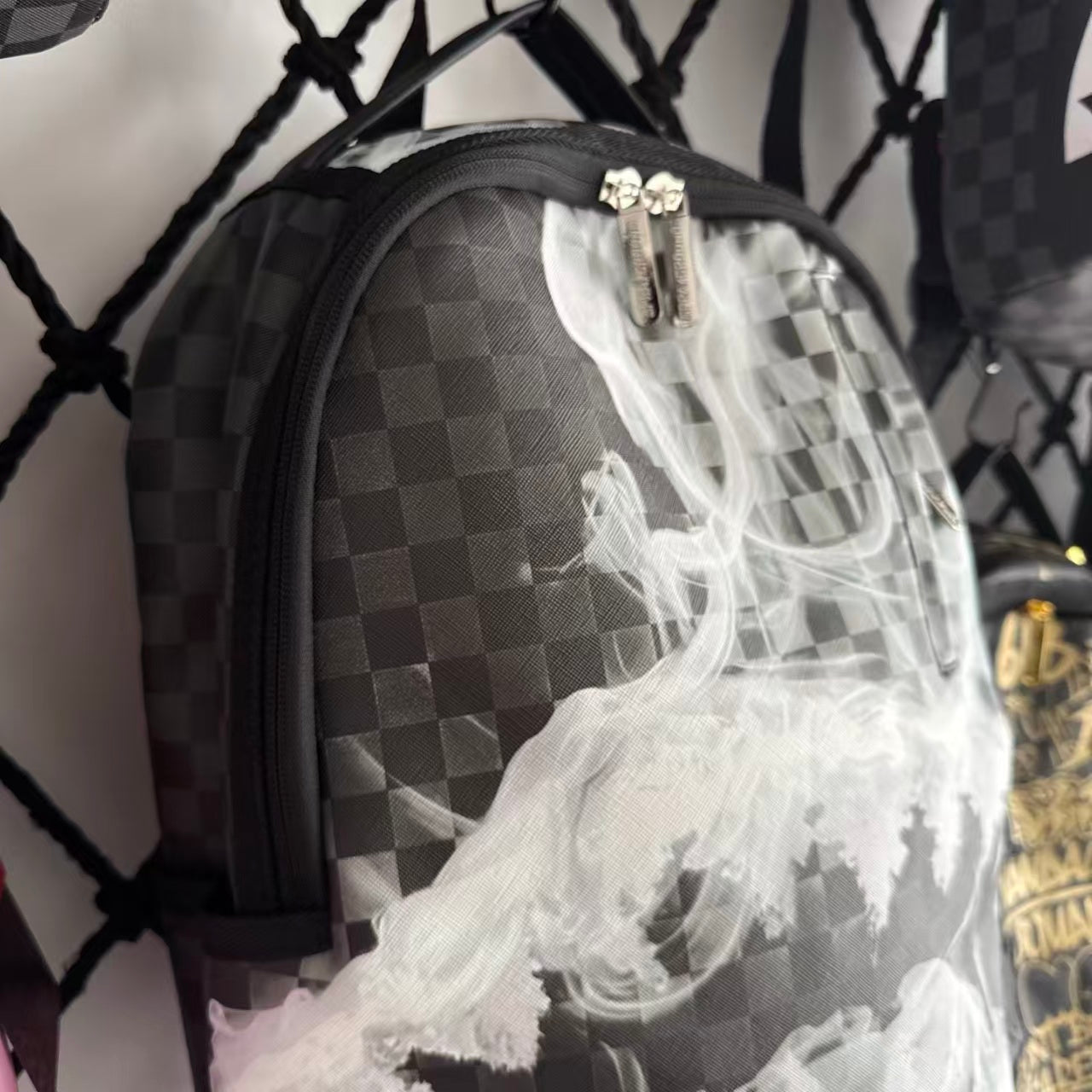 Black & Grey Checkerboard Backpack with Swirling White Smoke Effect