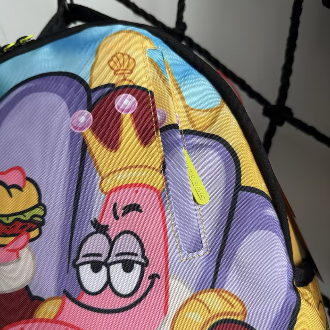 Cartoon Streetwear Backpack - Playful Pink Starfish with Crown Enjoying Hamburger Graffiti Illustration