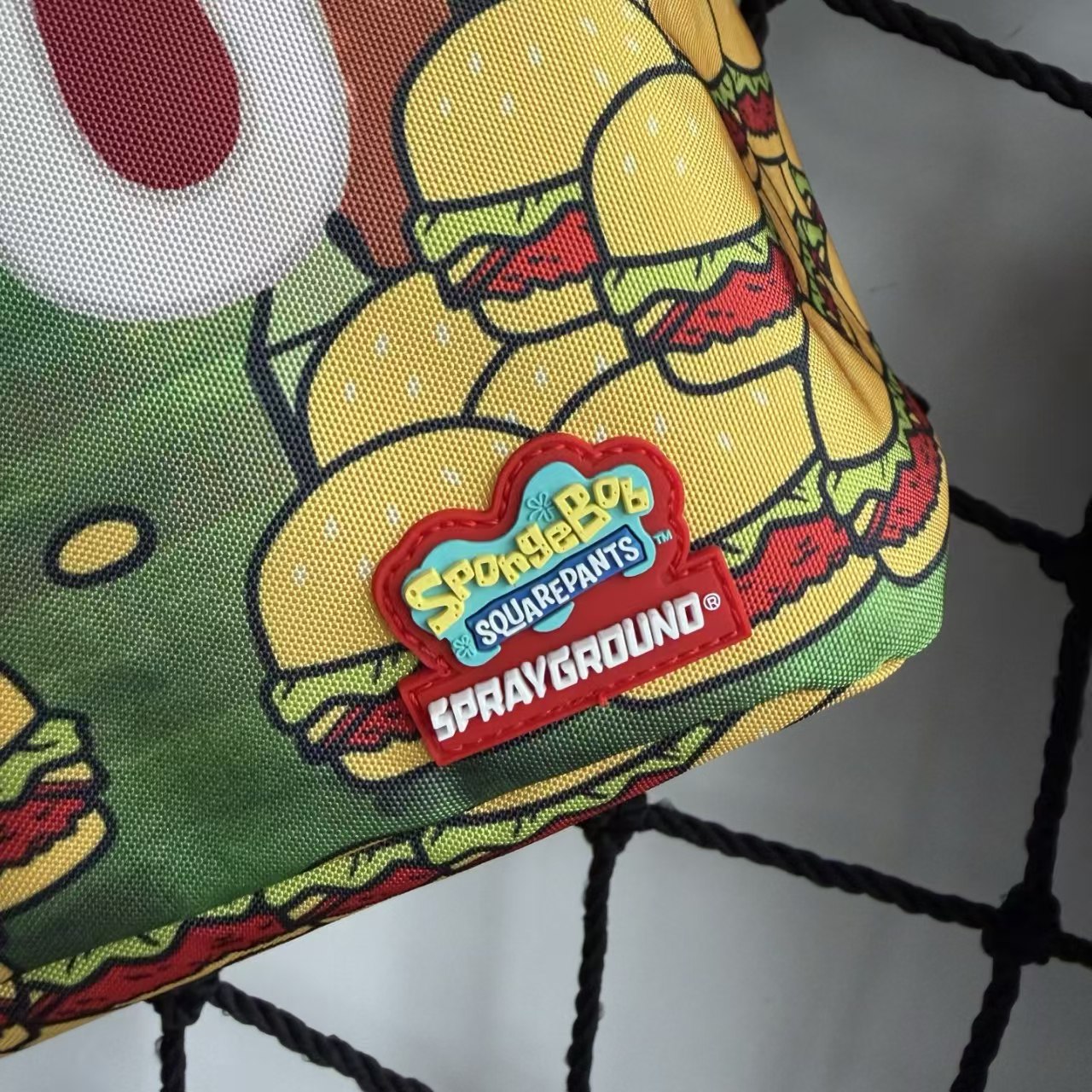 Cartoon Streetwear Backpack - Playful Pink Starfish with Crown Enjoying Hamburger Graffiti Illustration