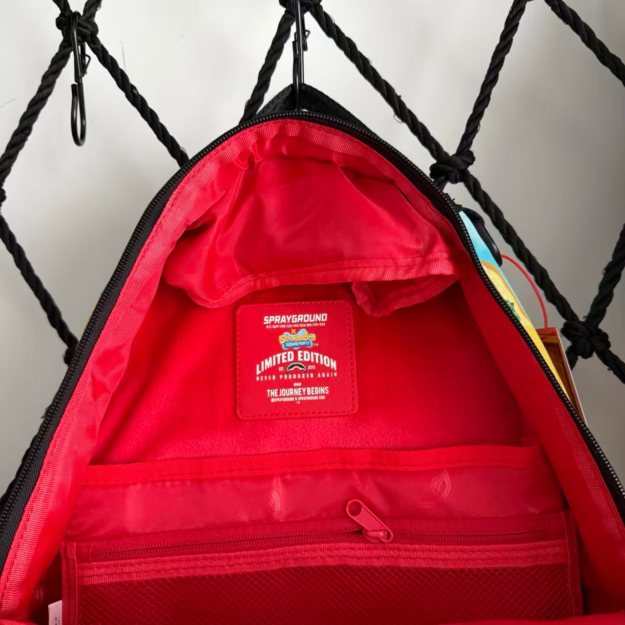 Cartoon Streetwear Backpack - Playful Pink Starfish with Crown Enjoying Hamburger Graffiti Illustration