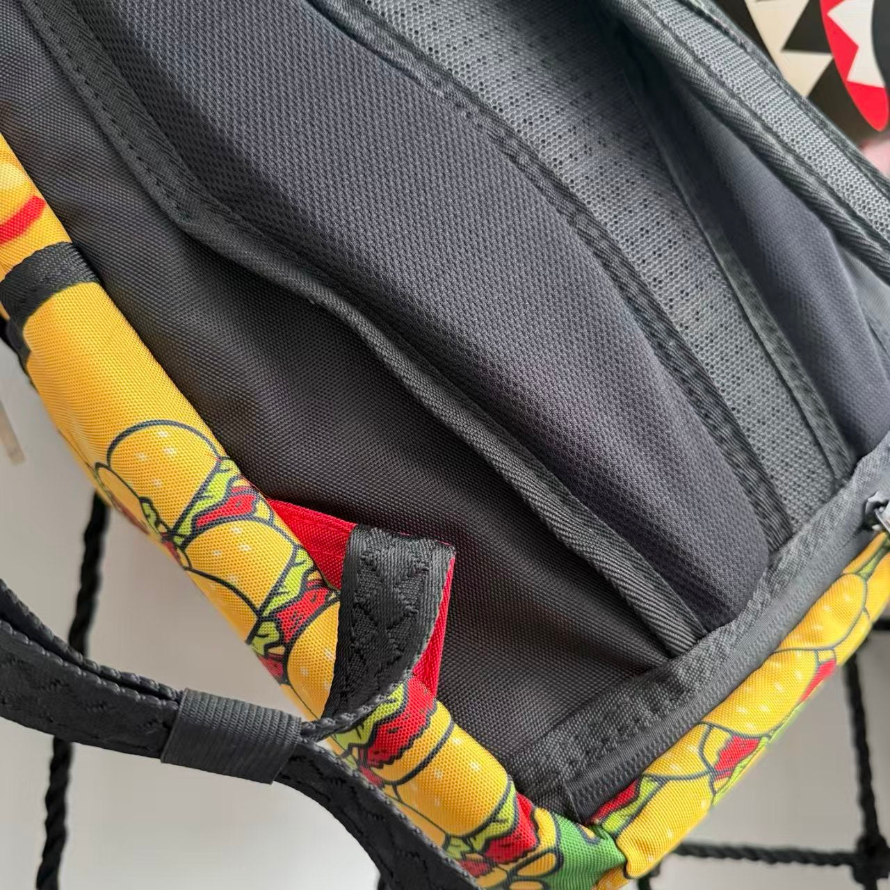 Cartoon Streetwear Backpack - Playful Pink Starfish with Crown Enjoying Hamburger Graffiti Illustration